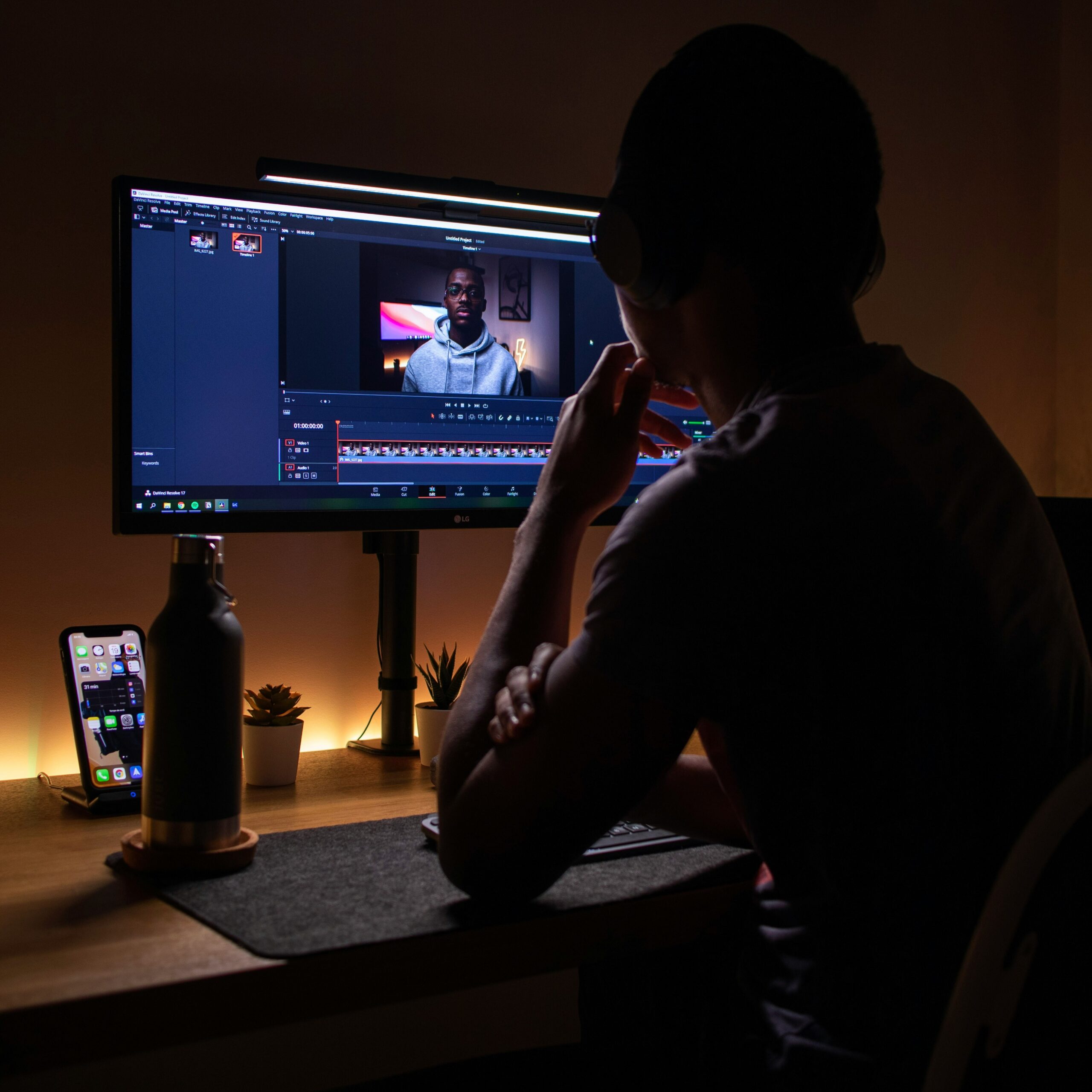 Person editing video on computer