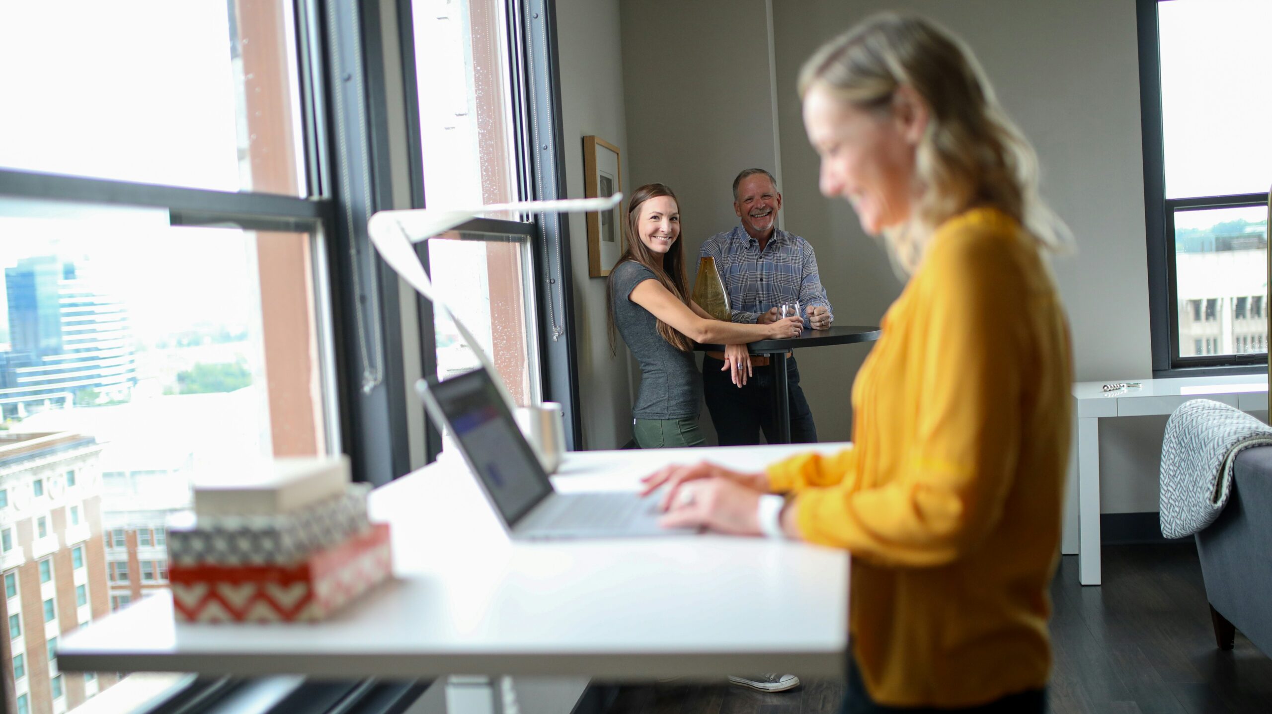 Coworkers sharing a smile in office